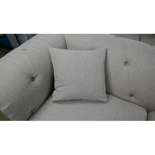 1350 - An oatmeal weave Chesterfield three seater sofa and footstool RRP £1379