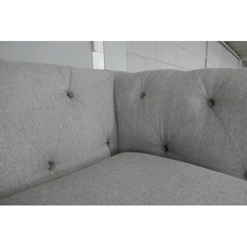 1388 - A grey weave Chesterfield three seater sofa, love seat and footstool RRP £2458