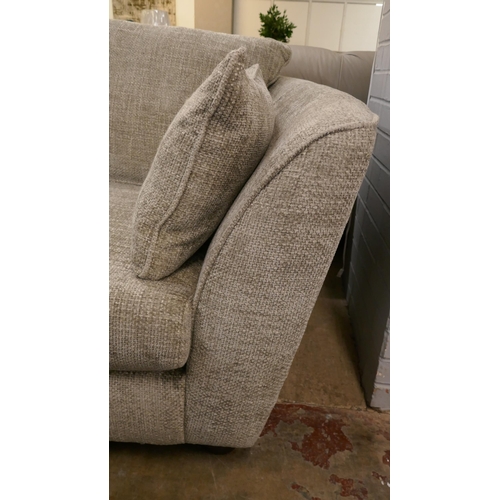 1407 - A pewter weave three seater sofa