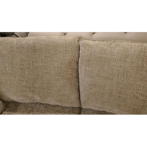 1407 - A pewter weave three seater sofa