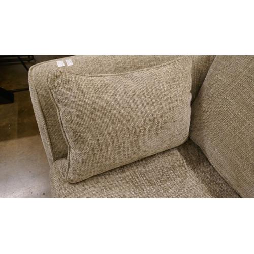 1407 - A pewter weave three seater sofa