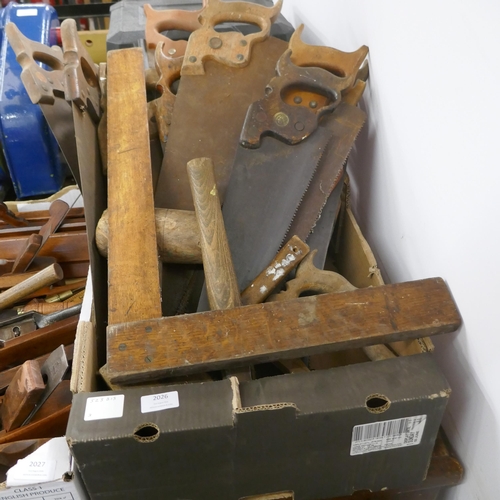 2026 - A large quantity of vintage wooden handled hand saws, wooden mallets and an oak set square and other... 