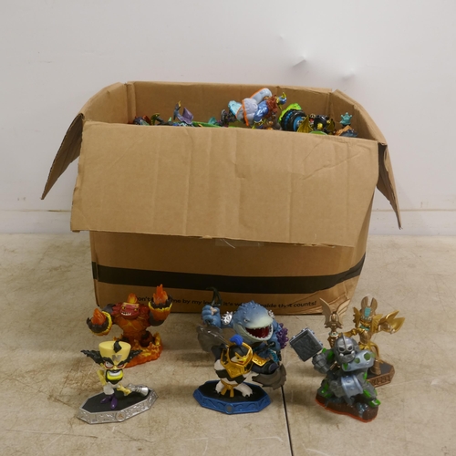 2072 - A box containing a large quantity of various Skylanders toys