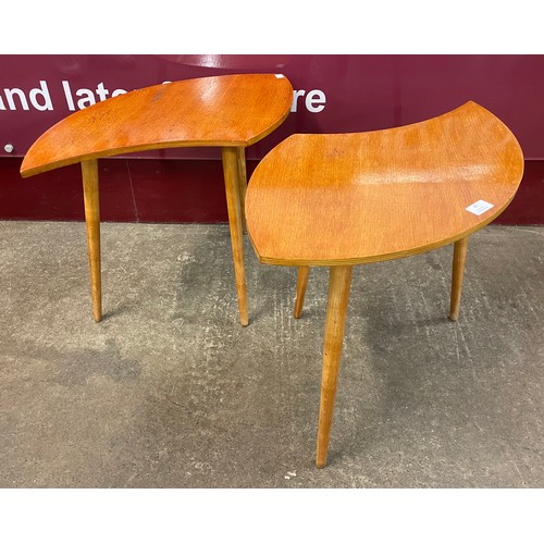 49 - A pair of teak asymmetrical occasional tables