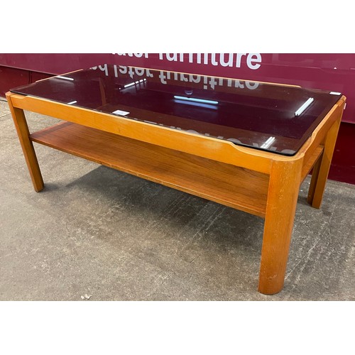 51 - A Myer teak and glass topped coffee table