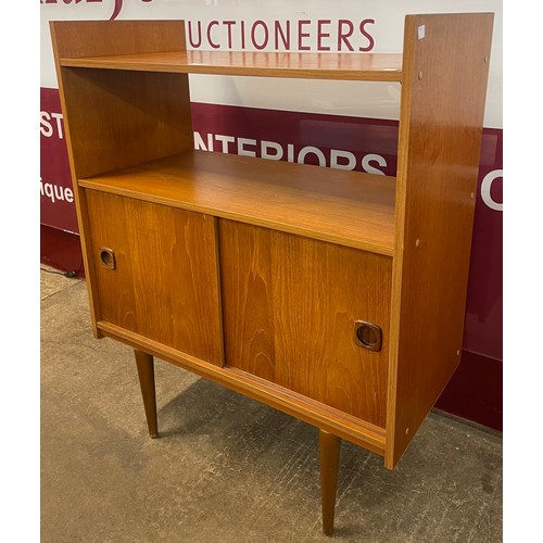 52 - A teak sliding door record cabinet