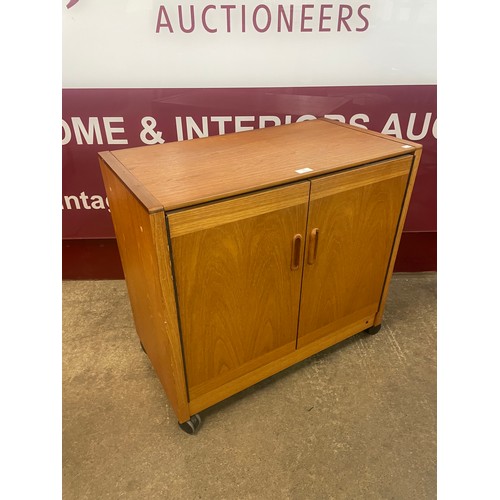 76 - A teak hostess cabinet