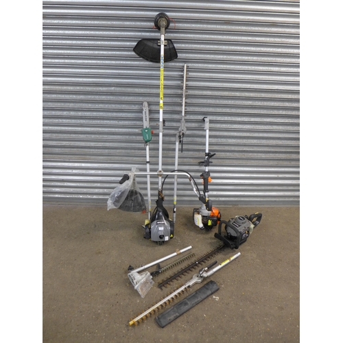 2158 - A quantity of garden tools including a pick axe, rakes, lawn aerator, brushes, etc.