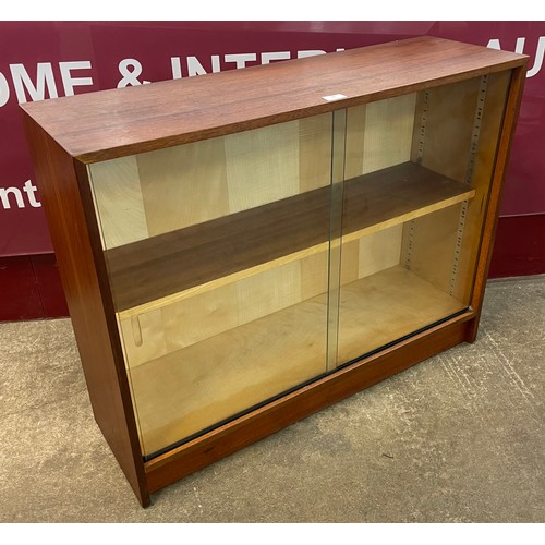 78 - An Austin Suite teak two door bookcase