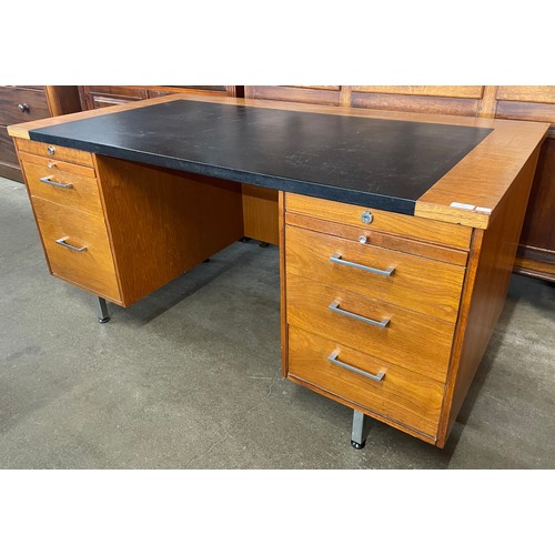 86 - An Abbess teak and black vinyl desk