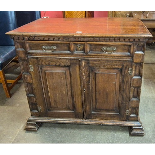 104 - An 18th Century French carved oak cupboard