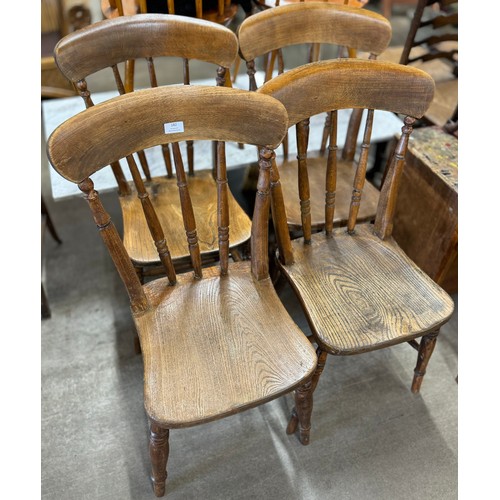 211 - A set of four Victorian elm and beech kitchen chairs