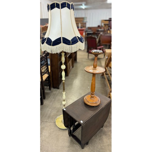 214 - A small oak drop leaf table, an oak smokers stand and an onyx and gilt metal standard lamp