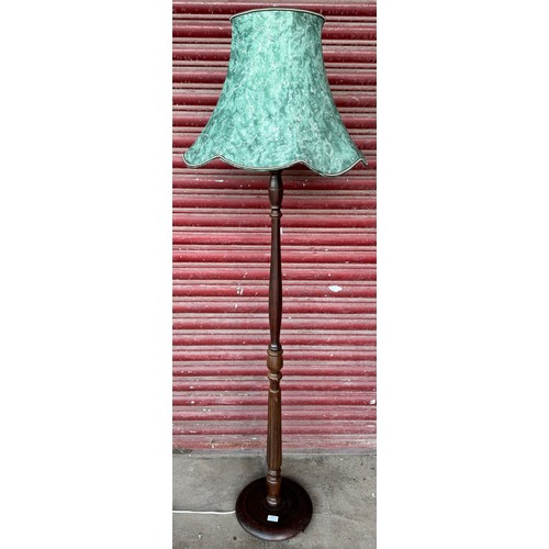 216 - A mahogany standard lamp