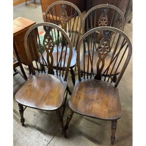 218 - A set of four elm and beech wheelback kitchen chairs