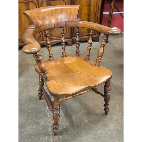 113 - A Victorian elm and beech smokers bow chair