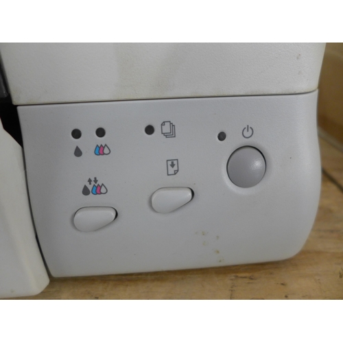 2260 - An Epson Stylus Photo 1270 printer with a software disk