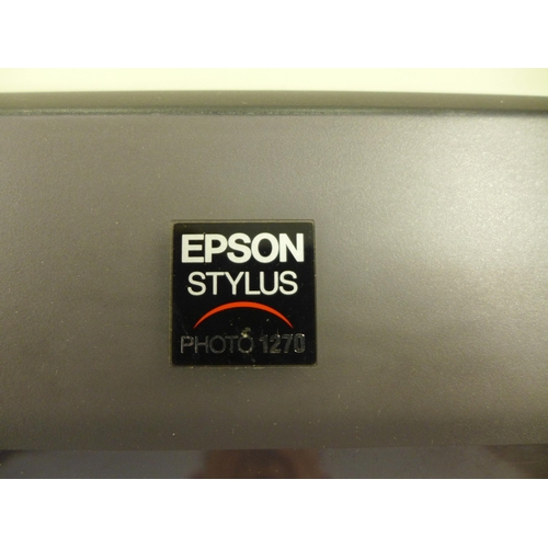 2260 - An Epson Stylus Photo 1270 printer with a software disk