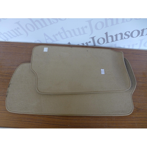 2279 - A set of beige fabric car mats