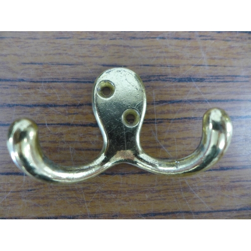 2250 - A box of brass door fittings including handles, hinges, coat hook, locks etc.