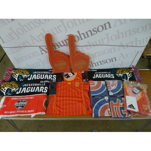 2255 - A large quantity of sports memorabilia, including scarves, cards, hats, shirts, mugs, magnets, foam ... 