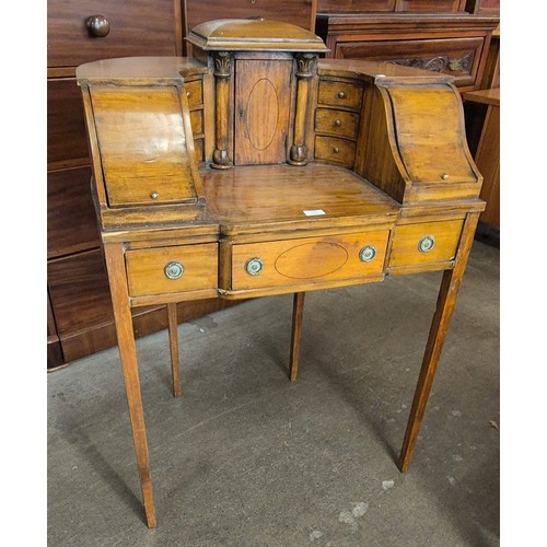 126 - A Regency style inlaid satinwood Carlton House desk