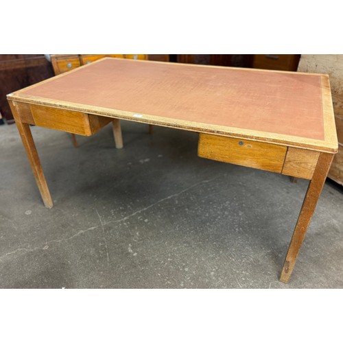 163 - A Lebetkin oak and tan leather topped desk