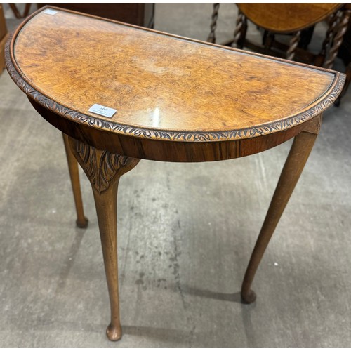 164 - A burr walnut demi-lune hall table