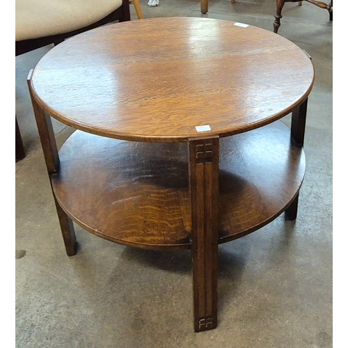 132 - An Art Deco Heals style oak two circular occasional table