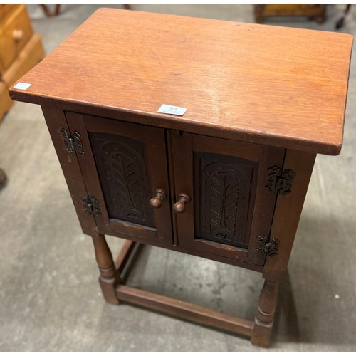 168 - A carved oak two door credence cupboard