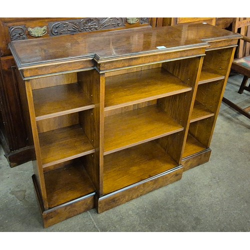 134 - A Regency style burr walnut breakfront open bookcase