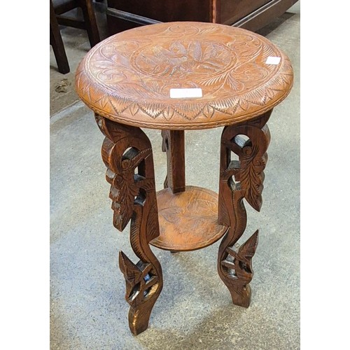 142 - An eastern carved hardwood circular occasional table