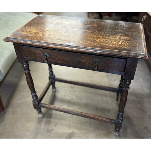 182 - A 17th Century style oak single drawer side table