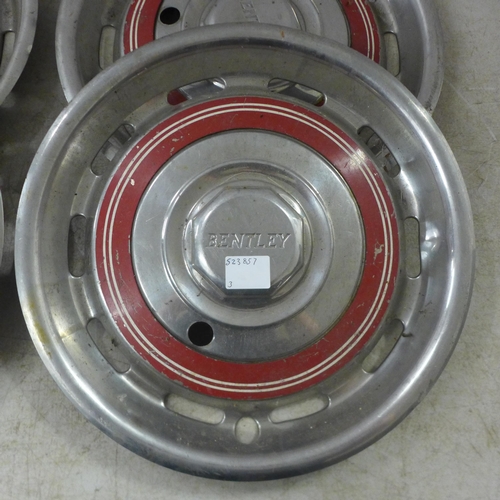 2044A - A set of four vintage stainless steel Bentley hub cap wheel covers