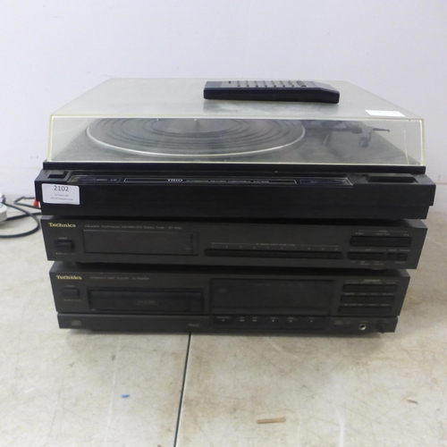 2102 - A quantity of stereo equipment including a Trio KD-34R Automatic return turntable, a Technics ST-610... 