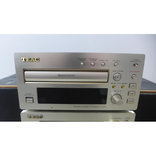 2104 - A quantity of stereo equipment including a Teac R-H300 cassette deck, a Teac T-H300 AM/FM tuner, a T... 