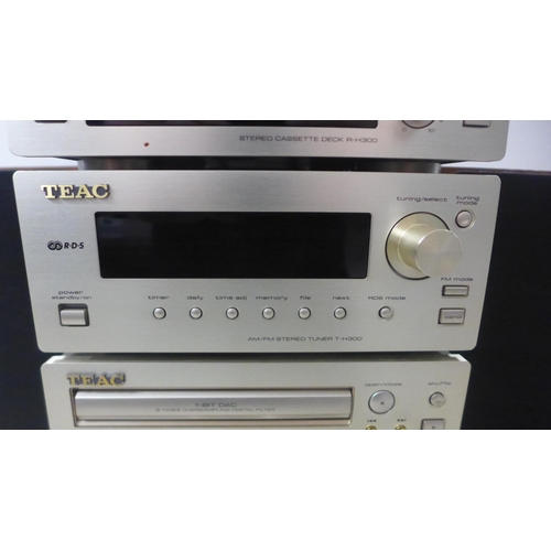 2104 - A quantity of stereo equipment including a Teac R-H300 cassette deck, a Teac T-H300 AM/FM tuner, a T... 