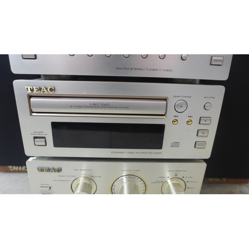 2104 - A quantity of stereo equipment including a Teac R-H300 cassette deck, a Teac T-H300 AM/FM tuner, a T... 