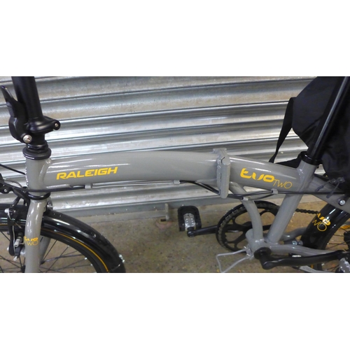 2136 - A Raleigh Evo Two folding City Bike with Shimano Revoshift gear set, panier rack and carry bag