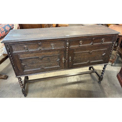 195 - An early 20th Century carved oak barleytwist sideboard