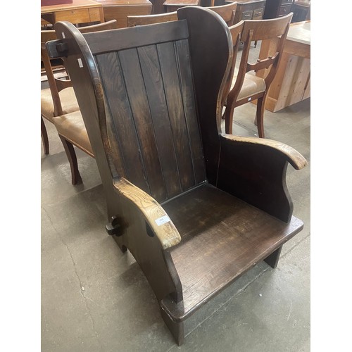 200 - An early 20th century oak cottage armchair