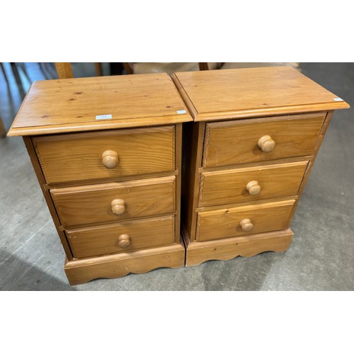 197 - A pair of three drawer pine bedsides