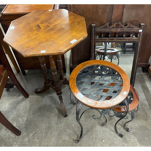 207 - A carved mahogany octagonal occasional table, two metal garden tables and an inlaid mahogany mirror