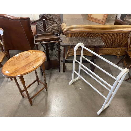 212 - An oak organ bench, an oak valet stand, a towel rail and a barleytwist occasional table