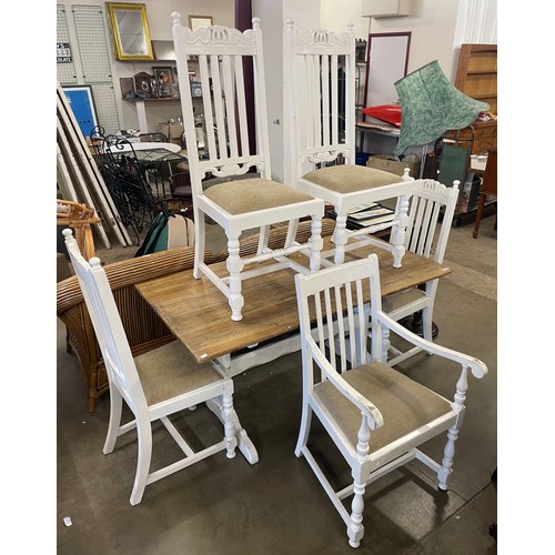 215 - A white painted carved oak dining table, four chairs and one other