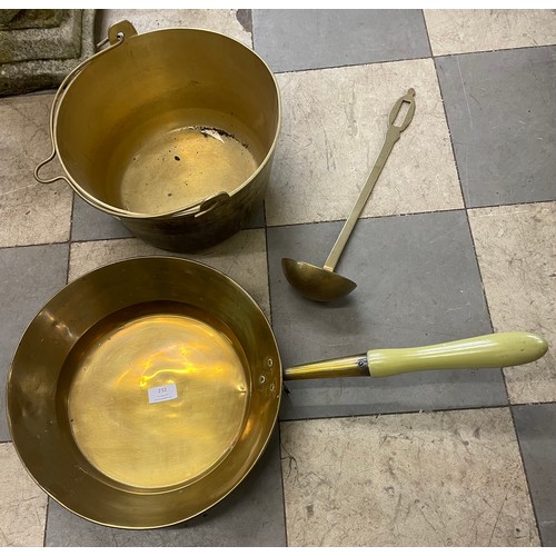 232 - A Victorian brass jam pan, ladle and saucepan