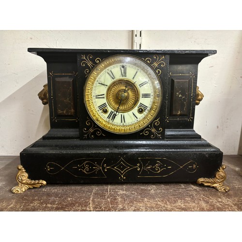 302 - A 19th Century French Belge noir and gilt metal mounted mantel clock