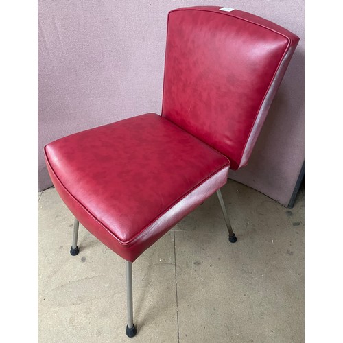 246 - A 1940's chrome and red vinyl adjustable salon chair