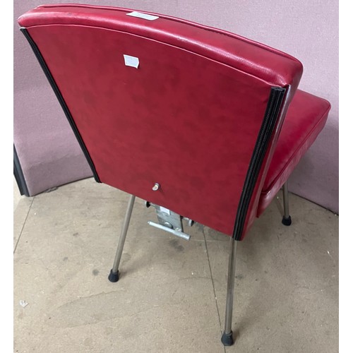 246 - A 1940's chrome and red vinyl adjustable salon chair