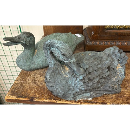 315 - A bronze figure of a duck and a concrete duck